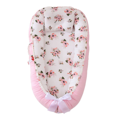 berceau bionique amovible cocon securise et evolutif pour bebe rose avec coussin
