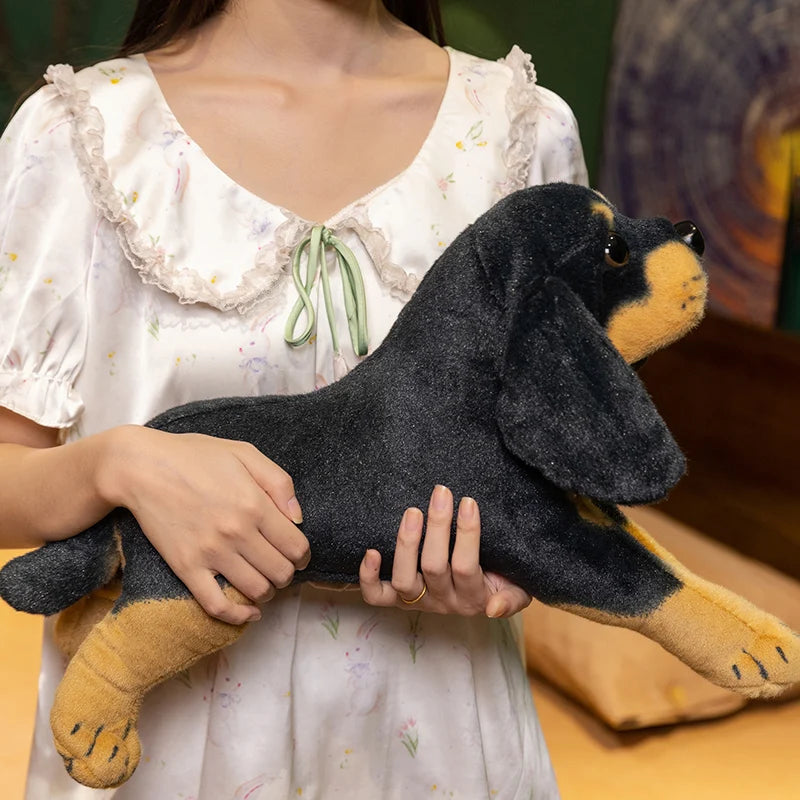 fille portant peluche chien realiste noir doudou chien pour enfant puppydoll